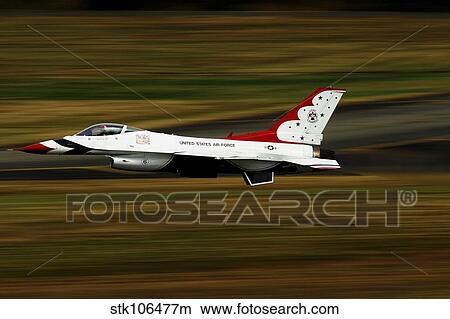 An F-16 Thunderbird of the U. S. Air Force flying at high speed. View Large Photo Image Picture - An F-16 Thunderbird of the U. S. Air Force flying at high speed.. Fotosearch