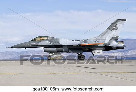 An F-16A Fighting Falcon of the famous US Navy TOPGUN Naval Fighter Weapons School. View Large Photo Image Picture - An F-16A Fighting Falcon of the famous US Navy TOPGUN Naval Fighter Weapons School.. Fotosearch
