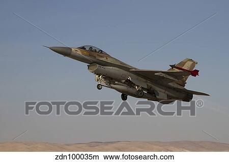 An F-16A Netz of the Israeli Air Force takes off from Nevatim Air Force Base. View Large Photo Image Picture - An F-16A Netz of the Israeli Air Force takes off from Nevatim Air Force Base.. Fotosearch