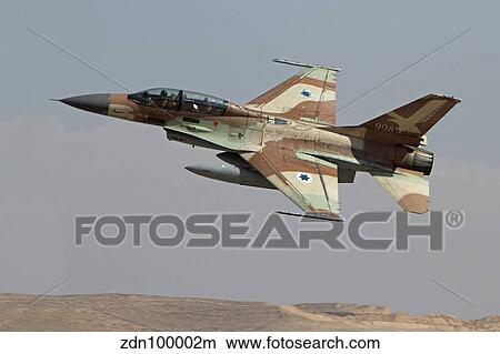 An F-16B Netz of the Israeli Air Force in flight over Israel. View Large Photo Image Picture - An F-16B Netz of the Israeli Air Force in flight over Israel.. Fotosearch