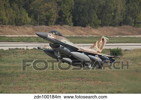 Picture - An F-16C Barak of the Israeli Air Force taking off from Hatzor Air Force Base.. Fotosearch