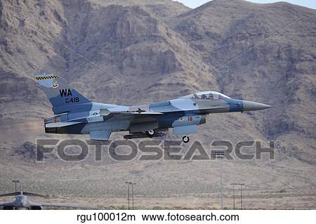 An F-16C Falcon of the 65th Aggressor Squadron taking off. View Large Photo Image Picture - An F-16C Falcon of the 65th Aggressor Squadron taking off.. Fotosearch