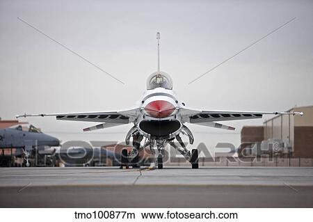 An F-16C Thunderbird sits on the ramp at Nellis Air Force Base, Nevada. View Large Photo Image Picture - An F-16C Thunderbird sits on the ramp at Nellis Air Force Base, Nevada.. Fotosearch