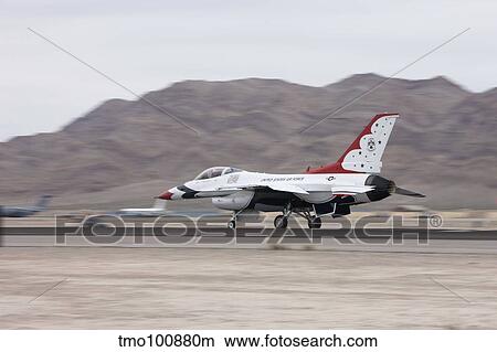 An F-16C Thunderbird sits on the runway at Nellis Air Force Base, Nevada. View Large Photo Image Picture - An F-16C Thunderbird sits on the runway at Nellis Air Force Base, Nevada.. Fotosearch
