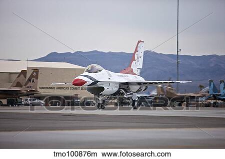 An F-16C Thunderbird taxis to the runway at Nellis Air Force Base, Nevada. View Large Photo Image Picture - An F-16C Thunderbird taxis to the runway at Nellis Air Force Base, Nevada.. Fotosearch