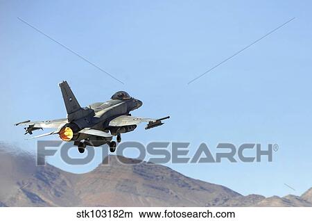 An F-16E from the United Arab Emirates taking off for a training mission at Nellis Air Force Base, Nevada. View Large Photo Image Picture - An F-16E from the United Arab Emirates taking off for a training mission at Nellis Air Force Base, Nevada.. Fotosearch