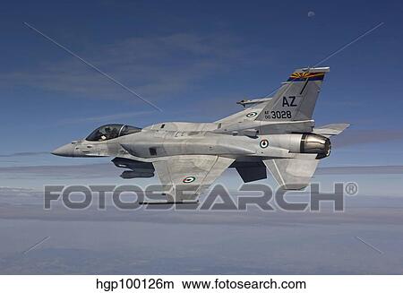 An F-16E maneuvers during a training mission over Arizona. View Large Photo Image Picture - An F-16E maneuvers during a training mission over Arizona.. Fotosearch