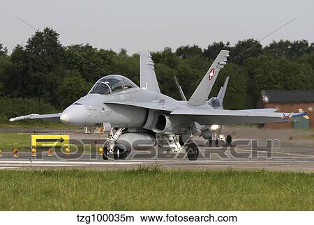 An F-18C Hornet of the Swiss Air Force taxiing for departure. View Large Photo Image Picture - An F-18C Hornet of the Swiss Air Force taxiing for departure.. Fotosearch