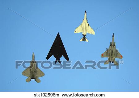 An F-22 Raptor, an F-117 Nighthawk, an F-4 Phantom and an F-15 Eagle in flight. View Large Photo Image Picture - An F-22 Raptor, an F-117 Nighthawk, an F-4 Phantom and an F-15 Eagle in flight.. Fotosearch