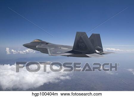 An F-22 Raptor flies around Southern New Mexico. View Large Photo Image Picture - An F-22 Raptor flies around Southern New Mexico.. Fotosearch