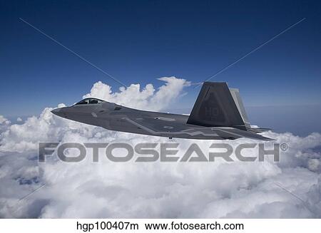 An F-22 Raptor flies around Southern New Mexico. View Large Photo Image Picture - An F-22 Raptor flies around Southern New Mexico.. Fotosearch