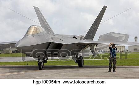 An F-22 Raptor goes through pre-flight checks at Kadena Air Base. View Large Photo Image Picture - An F-22 Raptor goes through pre-flight checks at Kadena Air Base.. Fotosearch
