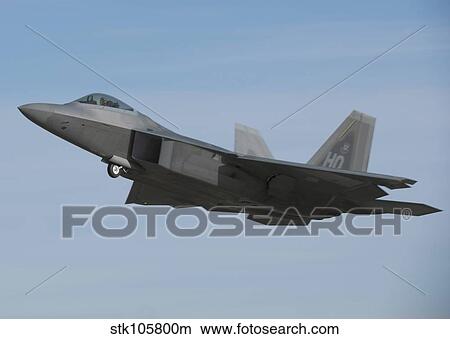 Picture - An F-22 Raptor in flight during a training mission.. Fotosearch
