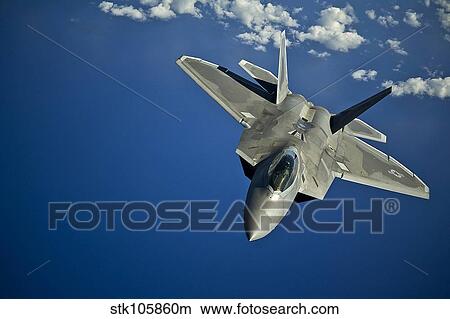Picture - An F-22 Raptor in flight near the Hawaiian Islands.. Fotosearch