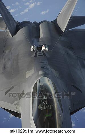 An F-22 Raptor moves into position to receive fuel. View Large Photo Image Picture - An F-22 Raptor moves into position to receive fuel.. Fotosearch