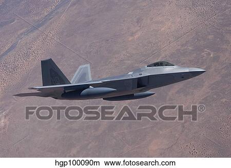 Picture - An F-22 Raptor on a training mission.. Fotosearch