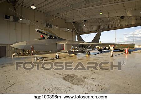 An F-22 Raptor parked in the hangar at Holloman Air Force Base. View Large Photo Image Picture - An F-22 Raptor parked in the hangar at Holloman Air Force Base.. Fotosearch
