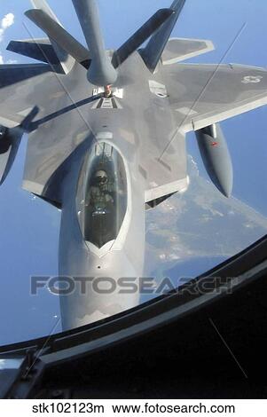 An F-22 Raptor receives fuel from a KC-135 Stratotanker. View Large Photo Image Picture - An F-22 Raptor receives fuel from a KC-135 Stratotanker.. Fotosearch
