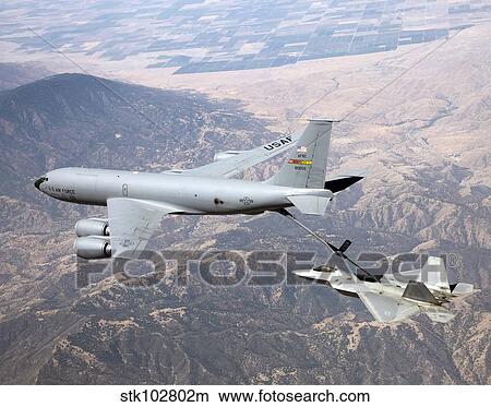 An F-22 Raptor receives fuel from a KC-135 Stratotanker. View Large Photo Image Picture - An F-22 Raptor receives fuel from a KC-135 Stratotanker.. Fotosearch