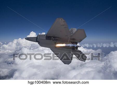 An F-22 Raptor releases a flare during a training mission. View Large Photo Image Picture - An F-22 Raptor releases a flare during a training mission.. Fotosearch