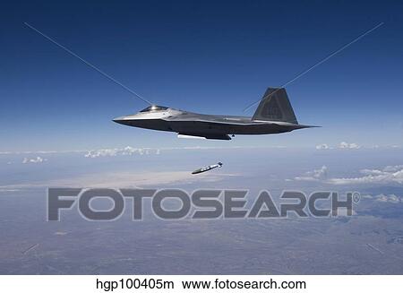 An F-22 Raptor releases a GBU-32 JDAM over New Mexico. View Large Photo Image Picture - An F-22 Raptor releases a GBU-32 JDAM over New Mexico.. Fotosearch