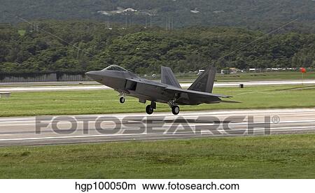 An F-22 Raptor takes off on a training mission from Kadena Air Base. View Large Photo Image Picture - An F-22 Raptor takes off on a training mission from Kadena Air Base.. Fotosearch