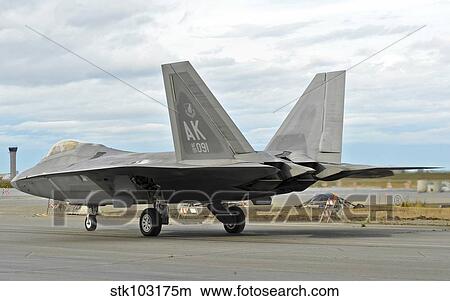 An F-22 Raptor taxi's the runway on Elmendorf Air Force Base, Alaska. View Large Photo Image Picture - An F-22 Raptor taxi's the runway on Elmendorf Air Force Base, Alaska.. Fotosearch