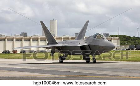 An F-22 Raptor taxi's to the end of runway at Kadena Air Base, Japan. View Large Photo Image Picture - An F-22 Raptor taxi's to the end of runway at Kadena Air Base, Japan.. Fotosearch