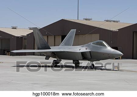 An F-22 Raptor taxi's to the runway for a training mission. View Large Photo Image Picture - An F-22 Raptor taxi's to the runway for a training mission.. Fotosearch