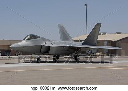 An F-22 Raptor taxi's to the runway for a training mission. View Large Photo Image Picture - An F-22 Raptor taxi's to the runway for a training mission.. Fotosearch