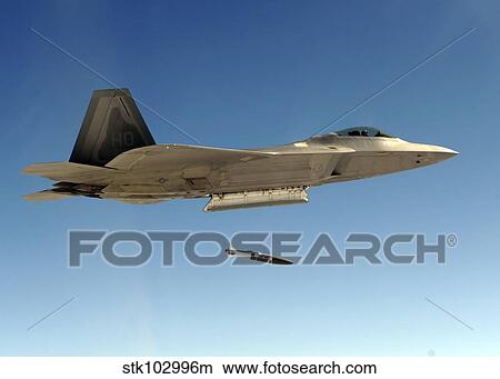 An F-22A Raptor drops a GBU-32 bomb. View Large Photo Image Picture - An F-22A Raptor drops a GBU-32 bomb.. Fotosearch