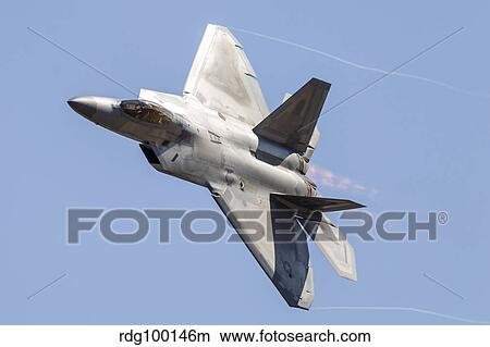 An F-22A Raptor of the U. S. Air Force turns at high speed. View Large Photo Image Picture - An F-22A Raptor of the U. S. Air Force turns at high speed.. Fotosearch