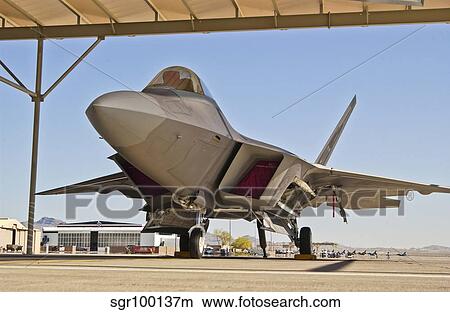 An F-22A Raptor parked at Nellis Air Force Base, Nevada. View Large Photo Image Picture - An F-22A Raptor parked at Nellis Air Force Base, Nevada.. Fotosearch