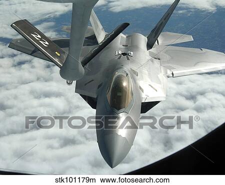 An F-22A Raptor refuels with a KC-135 Stratotanker. View Large Photo Image Picture - An F-22A Raptor refuels with a KC-135 Stratotanker.. Fotosearch