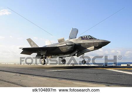 An F-35B Lightning II lifts off the flight deck of USS Wasp. View Large Photo Image Picture - An F-35B Lightning II lifts off the flight deck of USS Wasp.. Fotosearch