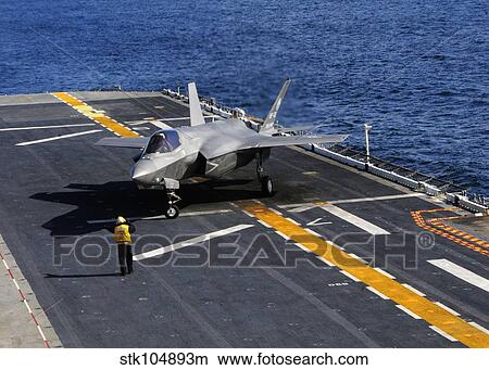 An F-35B Lightning II makes a vertical landing on the flight deck of USS Wasp. View Large Photo Image Picture - An F-35B Lightning II makes a vertical landing on the flight deck of USS Wasp.. Fotosearch