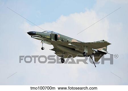 An F-4 Phantom in flight over Houston, Texas. View Large Photo Image Picture - An F-4 Phantom in flight over Houston, Texas.. Fotosearch