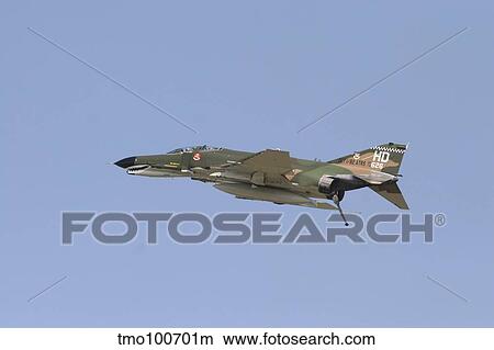 An F-4 Phantom in flight over Houston, Texas. View Large Photo Image Picture - An F-4 Phantom in flight over Houston, Texas.. Fotosearch