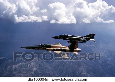 Picture - An F-5 Tiger II and F-4 Phantom II during a tactics development flight.. Fotosearch