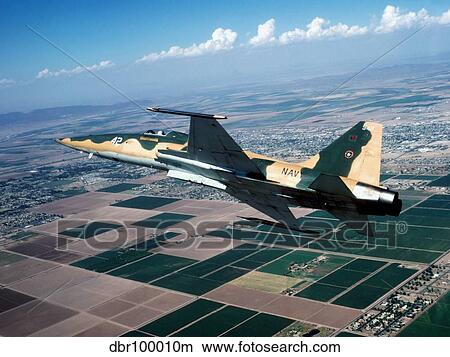 An F-5E Tiger II in flight over El Centro, California. View Large Photo Image Picture - An F-5E Tiger II in flight over El Centro, California.. Fotosearch