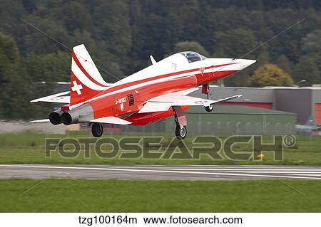 Picture - An F-5E Tiger of the Patrouille de Suisse demo team taking off.. Fotosearch
