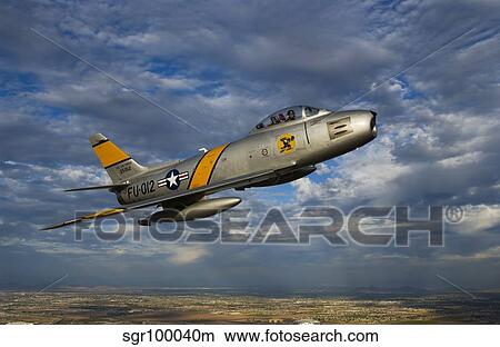 An F-86 Sabre jet in flight. View Large Photo Image Picture - An F-86 Sabre jet in flight.. Fotosearch