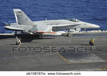 An F/18-A Hornet prepares to take off from USS George H. W. Bush. View Large Photo Image Picture - An F/18-A Hornet prepares to take off from USS George H. W. Bush.. Fotosearch