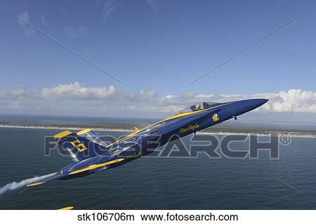 An F/A-18 Hornet from the Blue Angels during a training flight. View Large Photo Image Picture - An F/A-18 Hornet from the Blue Angels during a training flight.. Fotosearch