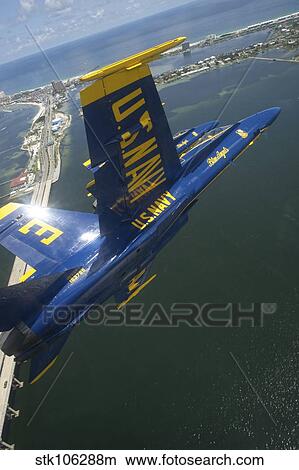 An F/A-18 Hornet of the Blue Angels over Pensacola Beach, Florida. View Large Photo Image Picture - An F/A-18 Hornet of the Blue Angels over Pensacola Beach, Florida.. Fotosearch