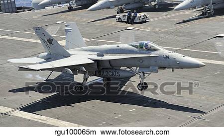 An F/A-18 Hornet of the U. S. Navy landing aboard USS Eisenhower. View Large Photo Image Picture - An F/A-18 Hornet of the U. S. Navy landing aboard USS Eisenhower.. Fotosearch