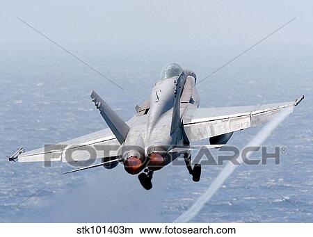An F/A-18 Hornet taking off. View Large Photo Image Picture - An F/A-18 Hornet taking off.. Fotosearch