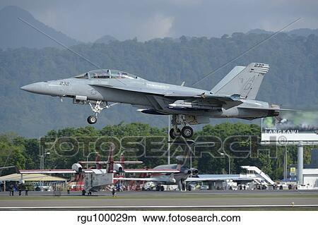 An F/A-18 Super Hornet of the U. S. Navy taking off from Langkawi Airport. View Large Photo Image Picture - An F/A-18 Super Hornet of the U. S. Navy taking off from Langkawi Airport.. Fotosearch