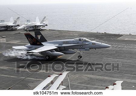 An F/A-18A+ Hornet lands aboard the aircraft carrier USS George H. W. Bush. View Large Photo Image Picture - An F/A-18A+ Hornet lands aboard the aircraft carrier USS George H. W. Bush.. Fotosearch