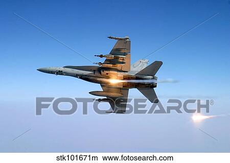 An F/A-18C Hornet aircraft tests its flare countermeasure system. View Large Photo Image Picture - An F/A-18C Hornet aircraft tests its flare countermeasure system.. Fotosearch